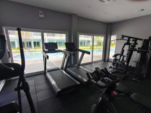 a gym with two treadmills and two tread machines at Babylon Sky Garden 2 in Rawai Beach