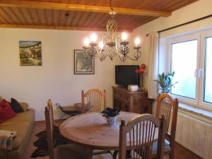 a living room with a table and a couch at Ferienwohnungen Haseloff in Kurort Oberwiesenthal