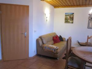 a living room with a couch and a table at Ferienwohnungen Haseloff in Kurort Oberwiesenthal