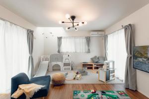 a living room with a childs play area with a crib at Sion MINATO in Nagoya