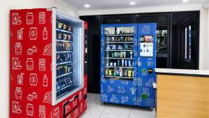 a grocery store with a refrigerator and soda at Central Luxury Apartments in Georgetown