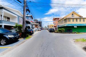 an empty street in a small town with buildings at Central Luxury Apartments in Georgetown