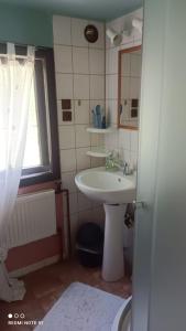 a small bathroom with a sink and a mirror at Chata Johanka in Stachy +23 photos