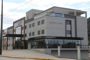 a building with a sign that reads wound hotel at Maranto Hotel in Pôrto União