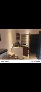 a kitchen with a sink and a counter top at Lions adventure in Narok