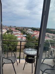 a balcony with a table and chairs and a view at Апартаменти біля чорноморського моря in Fontanka