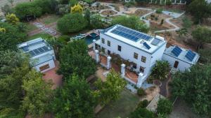 an aerial view of a house with solar panels on it at Christofphs in Bonnievale