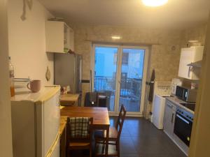 a kitchen with a table and a dining room at Landshuter str 17 in Straubing