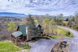an overhead view of a house with a road next to it at Poppy’s Place Cabin in Dandridge