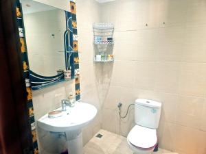 a small bathroom with a toilet and a sink at la Casa de doha in Tangier +18 photos