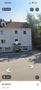 a large white building with arrows in front of it at Landshuter str 17 in Straubing +4 photos