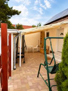 a patio with a house with a roof at Cozy Studio in Szentendre