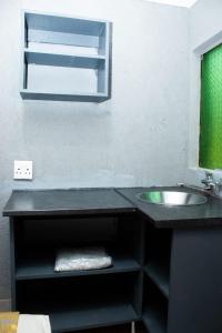 a bathroom with a sink and a mirror at Zairasbread in White River