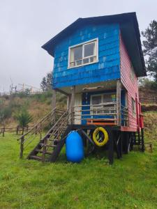 a house that is sitting on top of a field at Birloche in Butalcura +7 photos