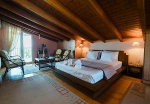 a bedroom with a large bed in a room at Agapi's House in Kanali