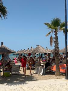 a group of people sitting on the beach at Casa Mare in Golem