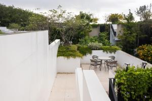 a small garden on the roof of a house at Qabalah Villa Private Pool & Rooftop Garden Stylish 2BR Retreat near Bang Tao in Ban Pak Lak