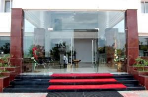 a red carpet on the stairs of a building at Vinay Residency in Sindhnūr