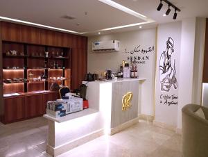 a store with a counter in a room at Sendan Residence in Dammam +65 photos