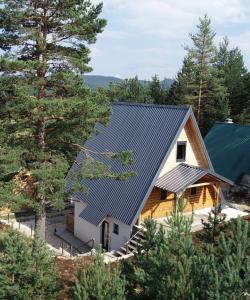 an aerial view of a house with a metal roof at Durmitor Den in Žabljak