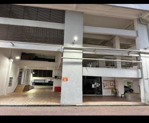 an empty parking lot in a large building at Anjung Seri Residence in Masai