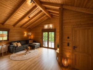a living room with a couch and a door at Gerhelm 3 in Velden