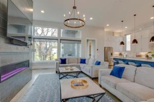 a living room with a couch and a table at Spacious Gulch Retreat Super Skyline Views in Nashville