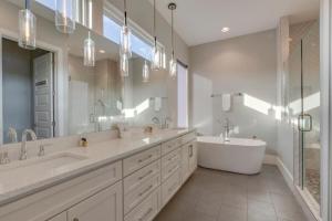 a large bathroom with two sinks and a tub and a bath tub at Spacious Gulch Retreat Super Skyline Views in Nashville +62 photos