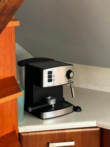 a coffee maker sitting on top of a counter at Apartament przy Wyspie in Piła +9 photos