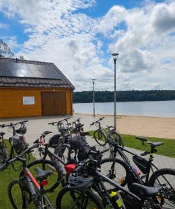 a bunch of bikes parked in front of a building at Apartament Centrum in Giby