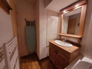 a bathroom with a sink and a mirror at Sunny chalettt great view ski in Puy-Saint-Vincent