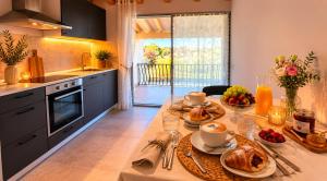 a kitchen with a table with food on it at Incanto del Garda in Monzambano