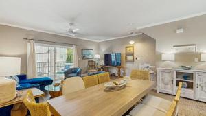 a living room with a table and chairs at Rehoboth Crossing - 36983 Grindstone Ln in Rehoboth Beach