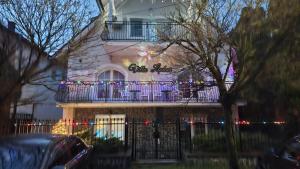 a building with christmas lights on a balcony at Villa Ladver in Hévíz