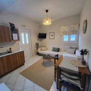 a living room with a couch and a table at Olga Dova Apartments in Ioannina