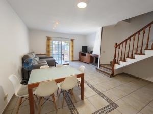 a living room with a table and chairs at Bonamar in Cabrera de Mar
