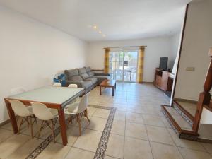 a living room with a couch and a table and chairs at Bonamar in Cabrera de Mar