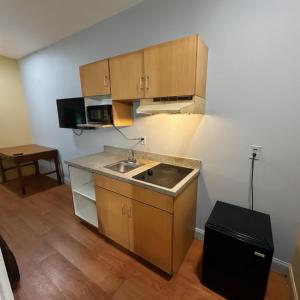 a kitchen with a sink and a counter top at Crown Inn in Carrollton
