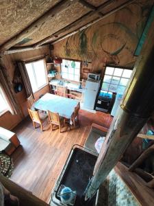 an aerial view of a kitchen and living room in a cabin at Birloche in Pindapulli