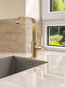 a kitchen with a sink with a faucet at Büdel's Spessart Lounge in Lohr am Main