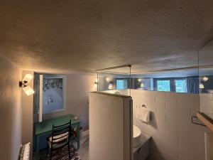 a bathroom with a refrigerator and a sink at Dar el Maasser in Maasser El Chouf +24 photos