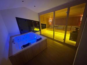 a large bath tub in a room with a window at Villa Keyf Göcek in Fethiye