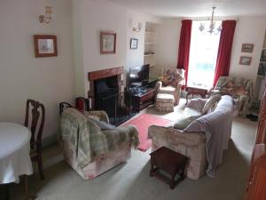 a living room with two couches and a fireplace at lake District cottage in Bootle