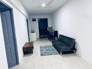 a living room with a couch and a coffee table at Hiyaa H7 in Hulhumale