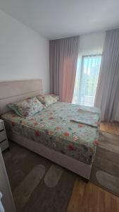 a bedroom with a bed and a window at Lovely apartmant Bar in Bar