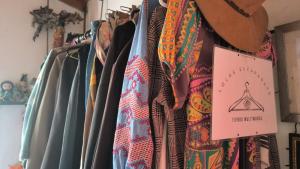 a bunch of ties on a rack in a store at Sendero Ancestral in Guarne