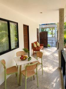 a living room with a table and chairs at The Verandas in Hinkong