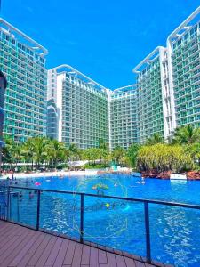 a view of a resort with a large swimming pool at SM Bicutan Quick Staycation PH in Manila