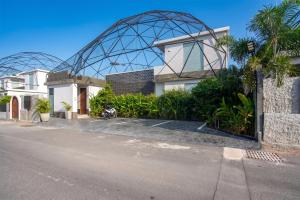 a building with a glass dome on the side of a street at Sawasdee pool villa, Hua Hin in Hua Hin