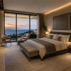 a bedroom with a large bed with a view of the ocean at vila del paraíso in Castelldefels
